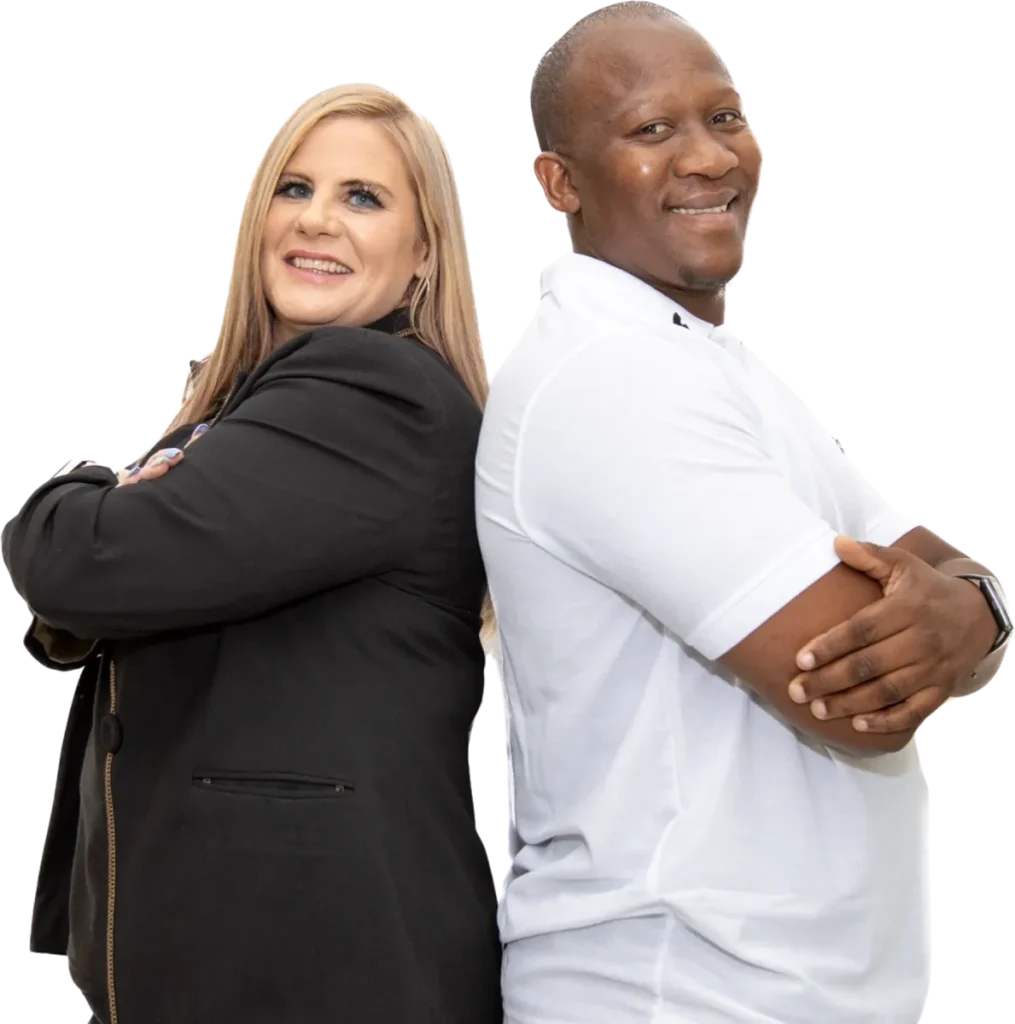 Two Dale Carnegie coaches standing back to back