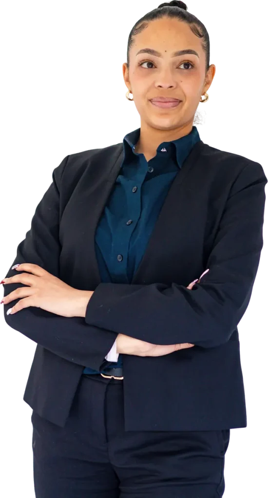 A professional in a navy suit with her arms folded