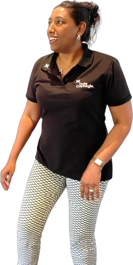 A Dale Carnegie facilitator in a branded polo shirt