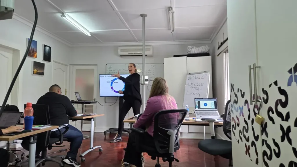 Two trainers coaching a participant during a session